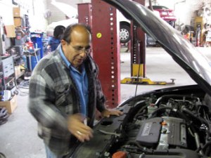 100109i-Magliozzi Ray Magliozzi looks over an engine Thursday, Oct. 1, 2009, at his Good News Garage in Cambridge.